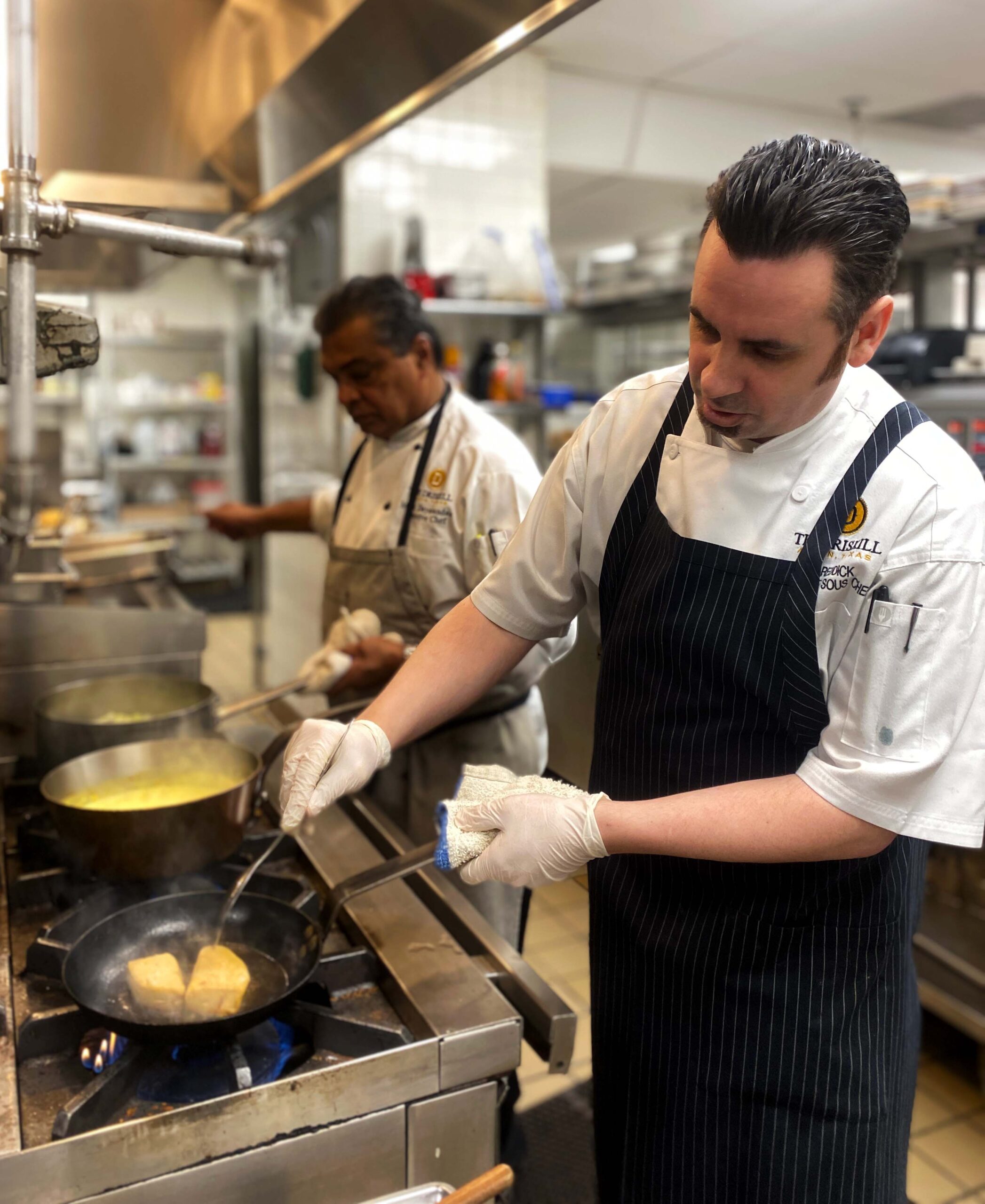 Chefs Mark and Iain cooking together in The Driskill kitchen