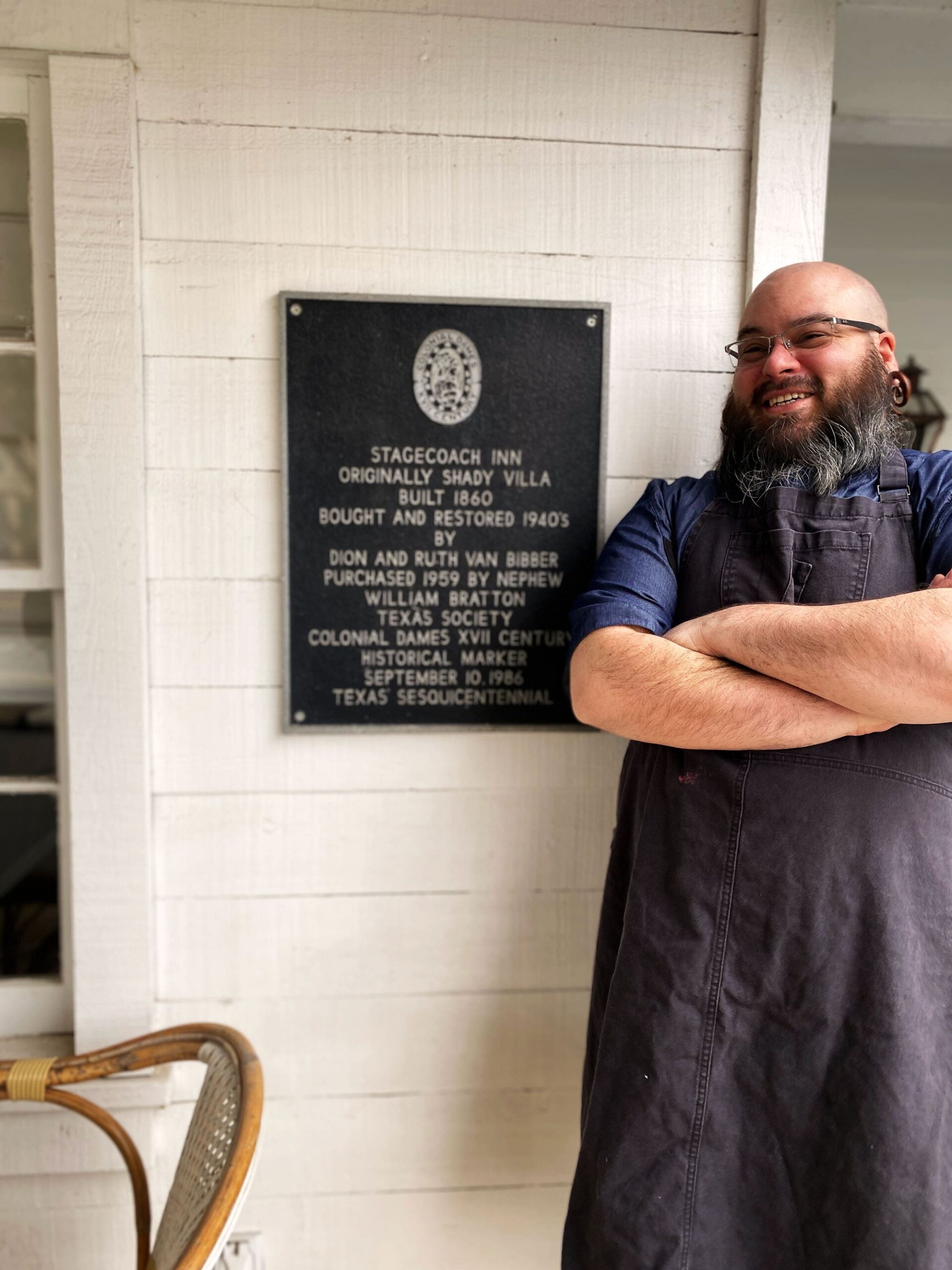 Executive Chef Patrick Dunlop smiling outside his restaurant, Stagecoach, in Salado, Texas.